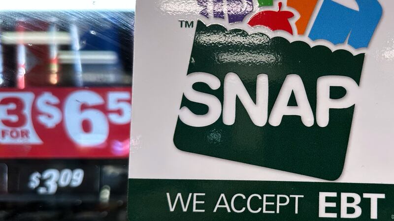 FILE - SNAP EBT information sign is displayed at a gas station in Riverwoods, Ill., Saturday,...
