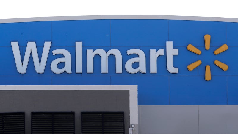 FILE - A Walmart logo is displayed outside of a Walmart store, in Walpole, Mass., Sept. 3,...